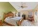 Bedroom with a decorative ceiling fan, wooden furnishings, and a bright, neutral color palette at 4768 Tivoli Ave, Sarasota, FL 34235