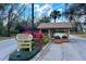 Community entrance with a welcome sign and manicured landscaping at 4768 Tivoli Ave, Sarasota, FL 34235