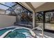 Inviting hot tub with a screened lanai and access to the home's interior at 4768 Tivoli Ave, Sarasota, FL 34235