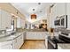 Bright kitchen with stainless steel appliances, granite countertops, tiled backsplash, and stone flooring at 4768 Tivoli Ave, Sarasota, FL 34235