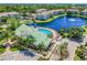 Aerial view of the complex showcasing the pool, pond, and surrounding residential buildings at 4802 51St W St # 613, Bradenton, FL 34210