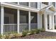 Close-up of a condo entrance featuring a screened-in porch and well-kept garden at 4802 51St W St # 613, Bradenton, FL 34210