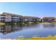 Scenic view of the community pond and well-maintained condo buildings at 4802 51St W St # 613, Bradenton, FL 34210