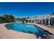 Inviting community pool with an outdoor seating area for relaxation at 4802 51St W St # 613, Bradenton, FL 34210