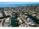 Picturesque aerial view of a waterfront community with canals, docks, and charming residences near the ocean at 505 65Th St, Holmes Beach, FL 34217