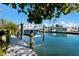 Private boat lift with clear canal views and a glimpse of the waterfront home at 505 65Th St, Holmes Beach, FL 34217