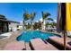 Beautiful pool area with lounge chairs and palm trees at 505 65Th St, Holmes Beach, FL 34217