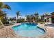 Sparkling pool surrounded by brick pavers, lounge chairs, and palm trees for a relaxing backyard experience at 505 65Th St, Holmes Beach, FL 34217