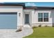 Modern front entrance with gray door and paver walkway at 514 Santiguay St, Punta Gorda, FL 33983