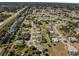 An expansive aerial view of a residential neighborhood with numerous homes and streets at 514 Santiguay St, Punta Gorda, FL 33983