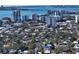 Aerial perspective of neighborhood homes, city skyline, and waterfront showcasing the prime location at 515 S Osprey Ave, Sarasota, FL 34236