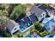 Aerial view of the property showcases the architectural design, roof, pool, and lush surroundings at 515 S Osprey Ave, Sarasota, FL 34236