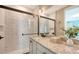 Elegant bathroom featuring a glass-enclosed shower, decorative vanity, and modern finishes at 515 S Osprey Ave, Sarasota, FL 34236