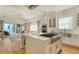 Bright, open kitchen featuring a large center island, pendant lighting, and stainless steel appliances at 515 S Osprey Ave, Sarasota, FL 34236