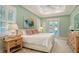 Serene main bedroom with light green walls, plantation shutters, and access to the outdoor patio area at 515 S Osprey Ave, Sarasota, FL 34236