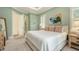 Bright and airy main bedroom with ensuite bathroom access, plantation shutters, and ample closet space at 515 S Osprey Ave, Sarasota, FL 34236