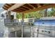 Outdoor kitchen area with a built-in grill, a bar, and stainless steel appliances at 515 S Osprey Ave, Sarasota, FL 34236