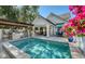 Backyard pool featuring an outdoor kitchen, patio seating, and lush landscaping for a serene atmosphere at 515 S Osprey Ave, Sarasota, FL 34236