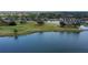 Breathtaking aerial view featuring the community, golf course, and a picturesque lake at 5251 Mahogany Run Ave # 526, Sarasota, FL 34241