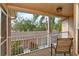 Relaxing screened in balcony area with views of the surrounding landscaping at 5251 Mahogany Run Ave # 526, Sarasota, FL 34241