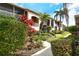 Close up exterior of the condo complex showing off the beautiful landscaping at 5251 Mahogany Run Ave # 526, Sarasota, FL 34241