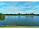 Tranquil lake view showcasing the water, landscaping, and golf course at 5251 Mahogany Run Ave # 526, Sarasota, FL 34241