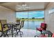 Enjoy the fresh air and a beautiful lake view from this covered patio at 5251 Mahogany Run Ave # 526, Sarasota, FL 34241