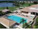 Beautiful aerial view of the pool and jacuzzi with golf course in the background at 5276 Mahogany Run Ave, Sarasota, FL 34241