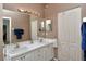 Bathroom featuring double sinks, large mirror, vanity with drawers, and neutral paint at 5276 Mahogany Run Ave, Sarasota, FL 34241