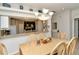 Charming dining area offering a view of the kitchen and featuring a unique chandelier at 5276 Mahogany Run Ave, Sarasota, FL 34241