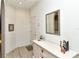 Bright foyer featuring neutral walls, tile floors, and a white storage cabinet with decorative accents at 5276 Mahogany Run Ave, Sarasota, FL 34241