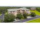 Building with a green roof and a tree-lined street at 5300 Manorwood Dr, Sarasota, FL 34235