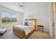 Bedroom with a wicker bed frame and plenty of natural light at 5300 Manorwood Dr, Sarasota, FL 34235