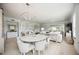 Bright dining room with a round table and modern chandelier at 5300 Manorwood Dr, Sarasota, FL 34235