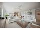 Bright and airy living room with two white sofas at 5300 Manorwood Dr, Sarasota, FL 34235