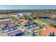 Aerial neighborhood view of community buildings, landscaping, mature trees and parking at 5400 34Th W St # A17, Bradenton, FL 34210