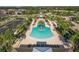 Aerial view of community pool, parking lot and recreation area surrounded by homes at 5580 Pleasantview Ct, Lakewood Ranch, FL 34211