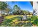 Serene backyard with lush green lawn and seating area, perfect for outdoor enjoyment at 5580 Pleasantview Ct, Lakewood Ranch, FL 34211