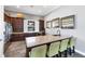 Clubhouse kitchenette with stainless steel appliances, dark wood cabinets, and bar stool seating at 5580 Pleasantview Ct, Lakewood Ranch, FL 34211