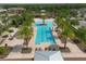 A beautiful swimming pool with an island in the middle and a pool deck with lounge chairs at 5580 Pleasantview Ct, Lakewood Ranch, FL 34211