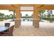 View of community pool area showing entrance framed by stone-clad columns at 5580 Pleasantview Ct, Lakewood Ranch, FL 34211