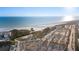 Beautiful aerial view of a white sand beach, parking and oceanfront condos at 5630 Saint Louis Ave, Sarasota, FL 34233