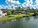 Aerial view of a large waterfront backyard with mature trees and tropical landscaping at 5630 Saint Louis Ave, Sarasota, FL 34233