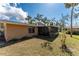 View of the home's backyard and screened-in porch at 5630 Saint Louis Ave, Sarasota, FL 34233