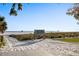 Picturesque entrance to Siesta Beach with white sand, clear skies, and vibrant signage at 5630 Saint Louis Ave, Sarasota, FL 34233