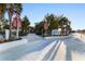 Entrance to Siesta Beach with palm trees, lush landscaping, and inviting walkways at 5630 Saint Louis Ave, Sarasota, FL 34233