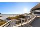 Scenic beach view with white railings, beach access, and ocean views from a building's vantage point at 5630 Saint Louis Ave, Sarasota, FL 34233