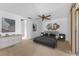 Stylishly decorated bedroom with a ceiling fan, neutral tones, and carpeted floors for comfort at 5630 Saint Louis Ave, Sarasota, FL 34233