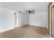 Spacious bedroom featuring ceiling fan, carpeted floors, and ample space at 5630 Saint Louis Ave, Sarasota, FL 34233