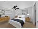 Comfortable bedroom featuring a ceiling fan, carpeted floors, and natural light from dual windows at 5630 Saint Louis Ave, Sarasota, FL 34233